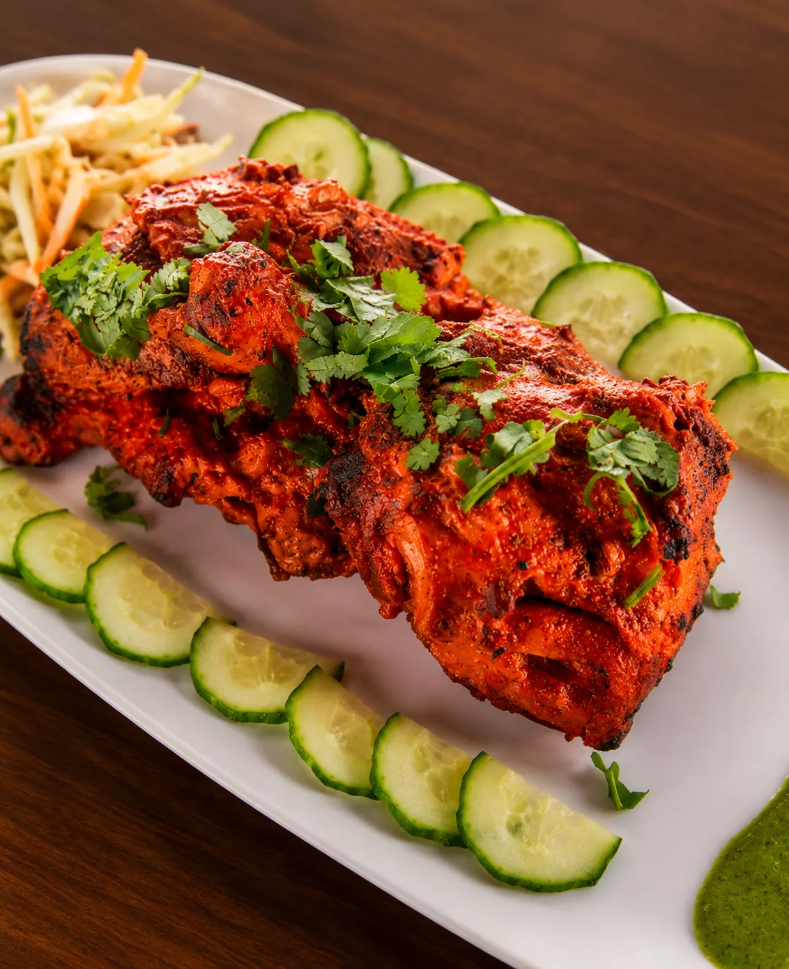Tandoori chicken marinated in yogurt and spices, chargrilled at Tamarind East Indian Restaurant, Panorama Hills Calgary